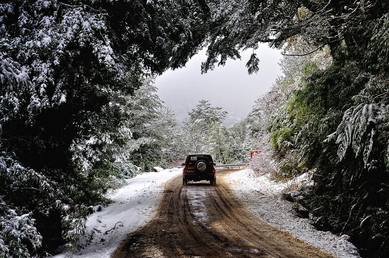 Red Car on Snowy Road — White