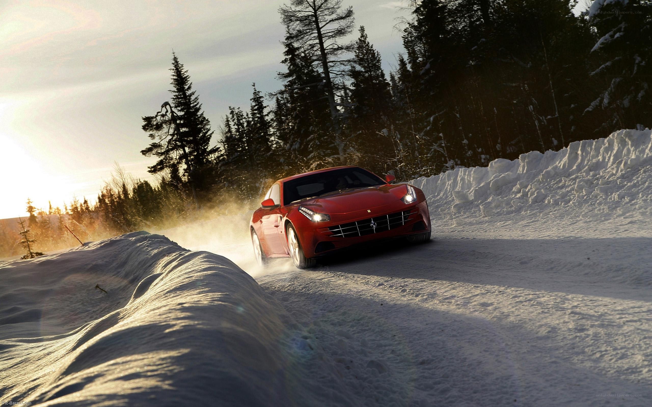 Red car on snowy road