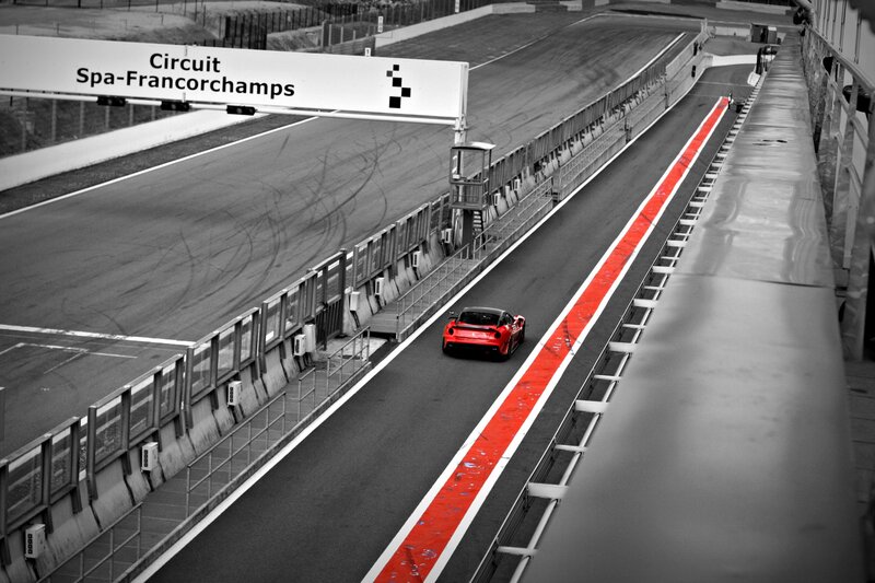 Red car on Spa-Francorchamps track