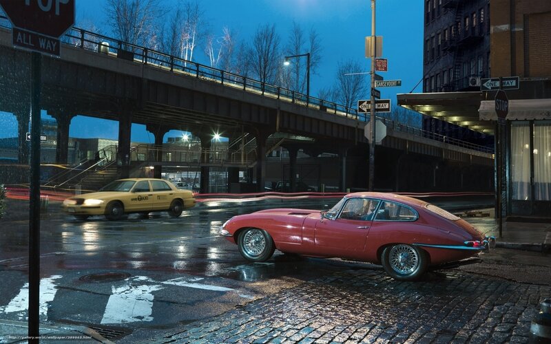 Red car on wet city street