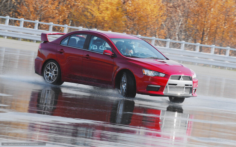 Red car on wet track