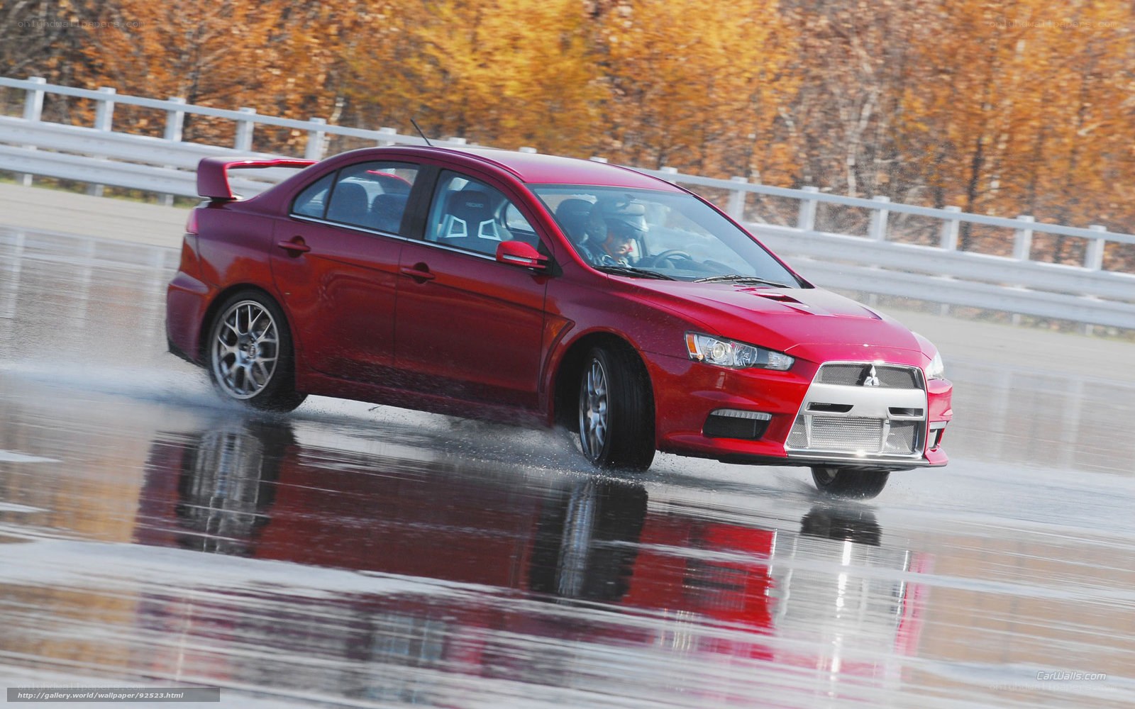 Red car on wet track