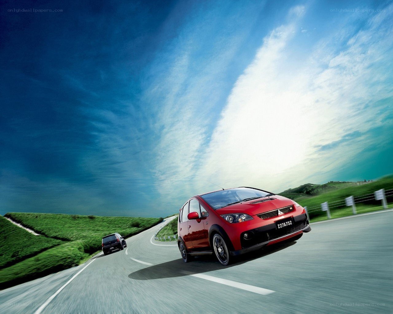 Red car on winding road