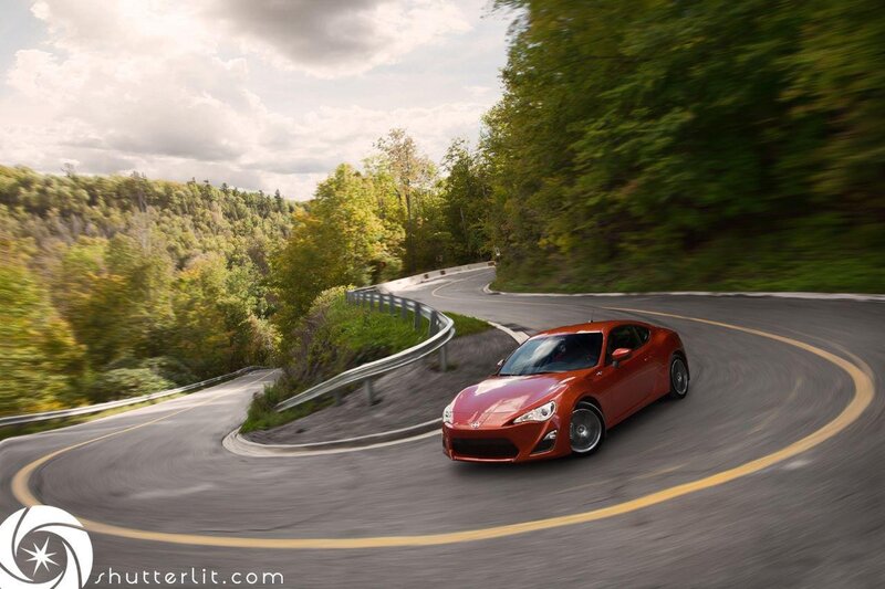Red car on winding road