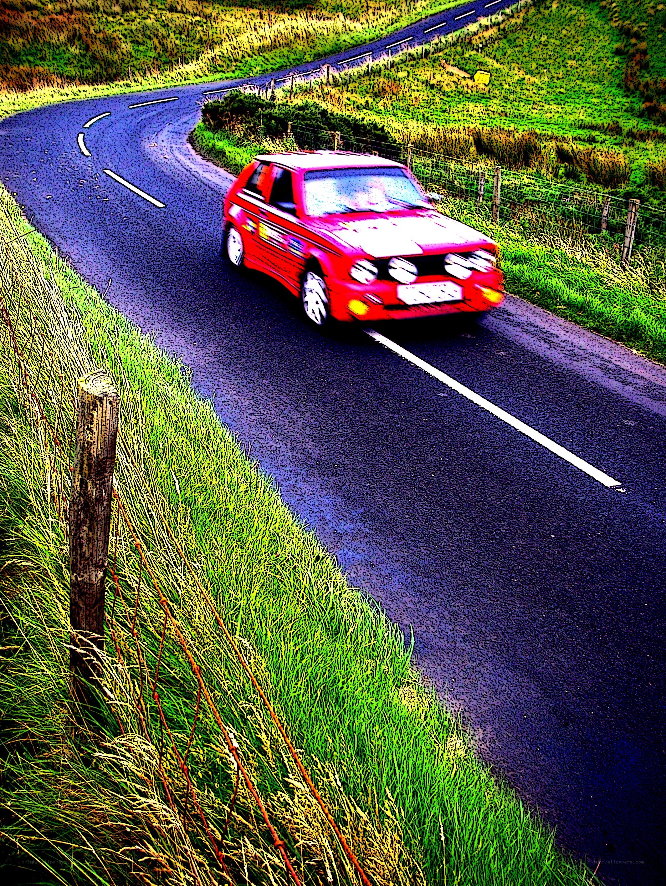 Red car on winding road