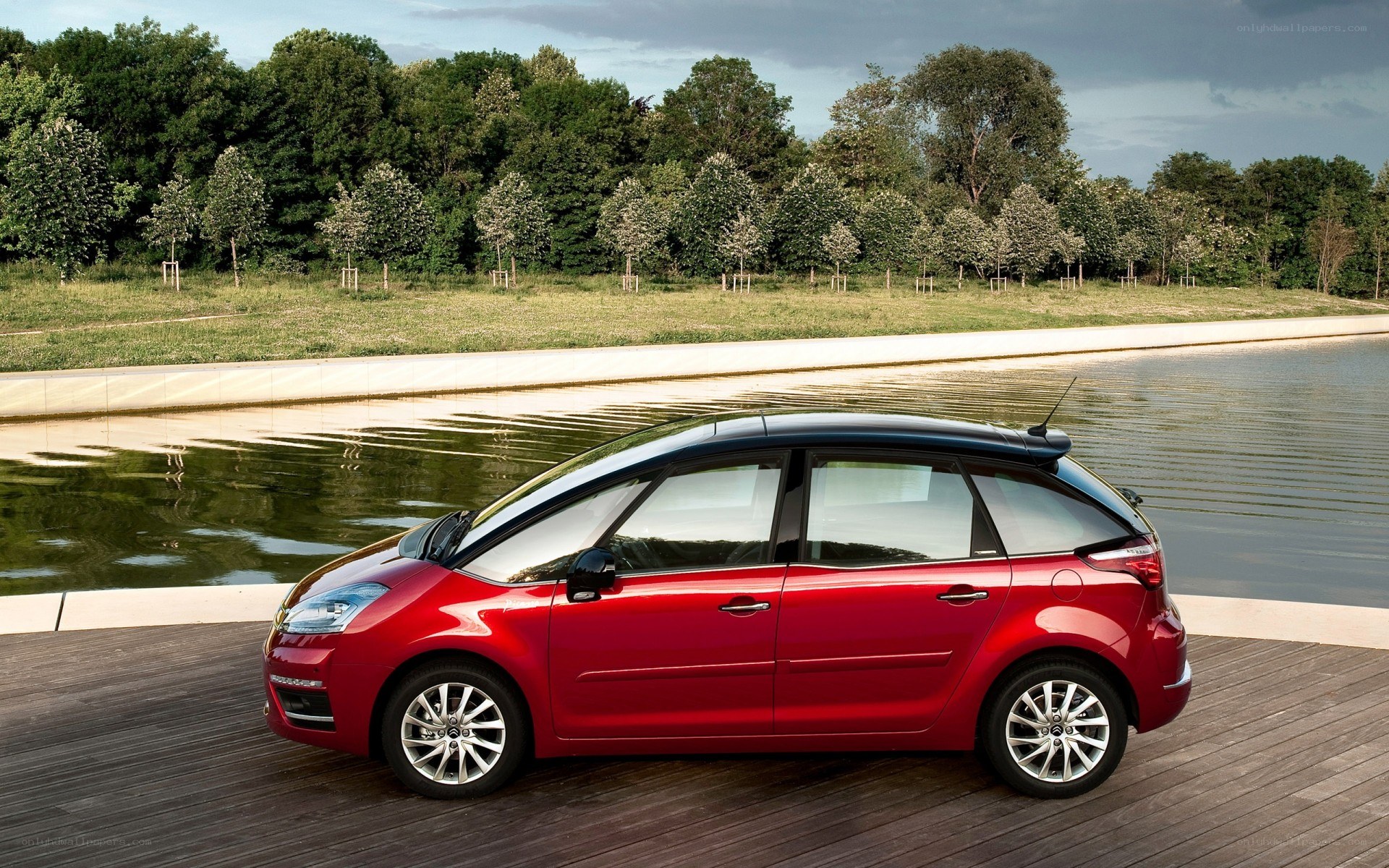 Red car on wooden deck