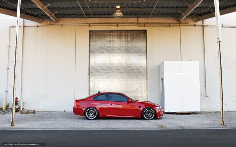 Red car parked in garage