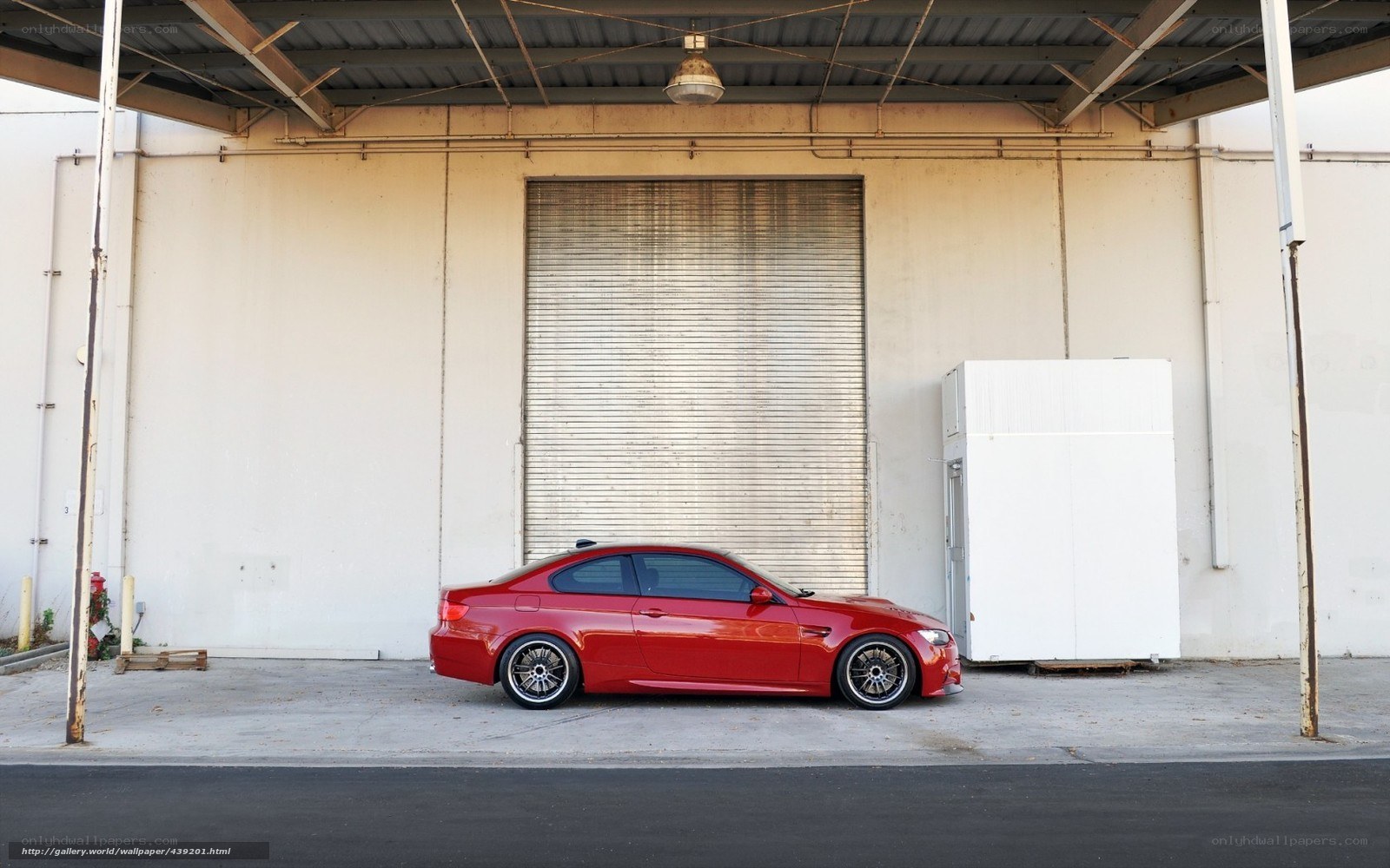 Red car parked in garage