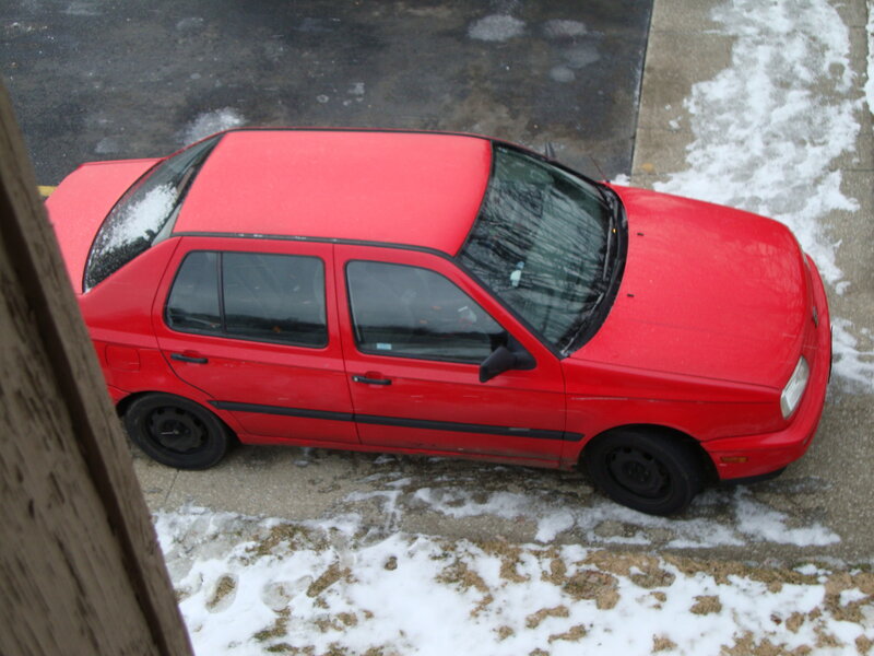 Red car parked in snow