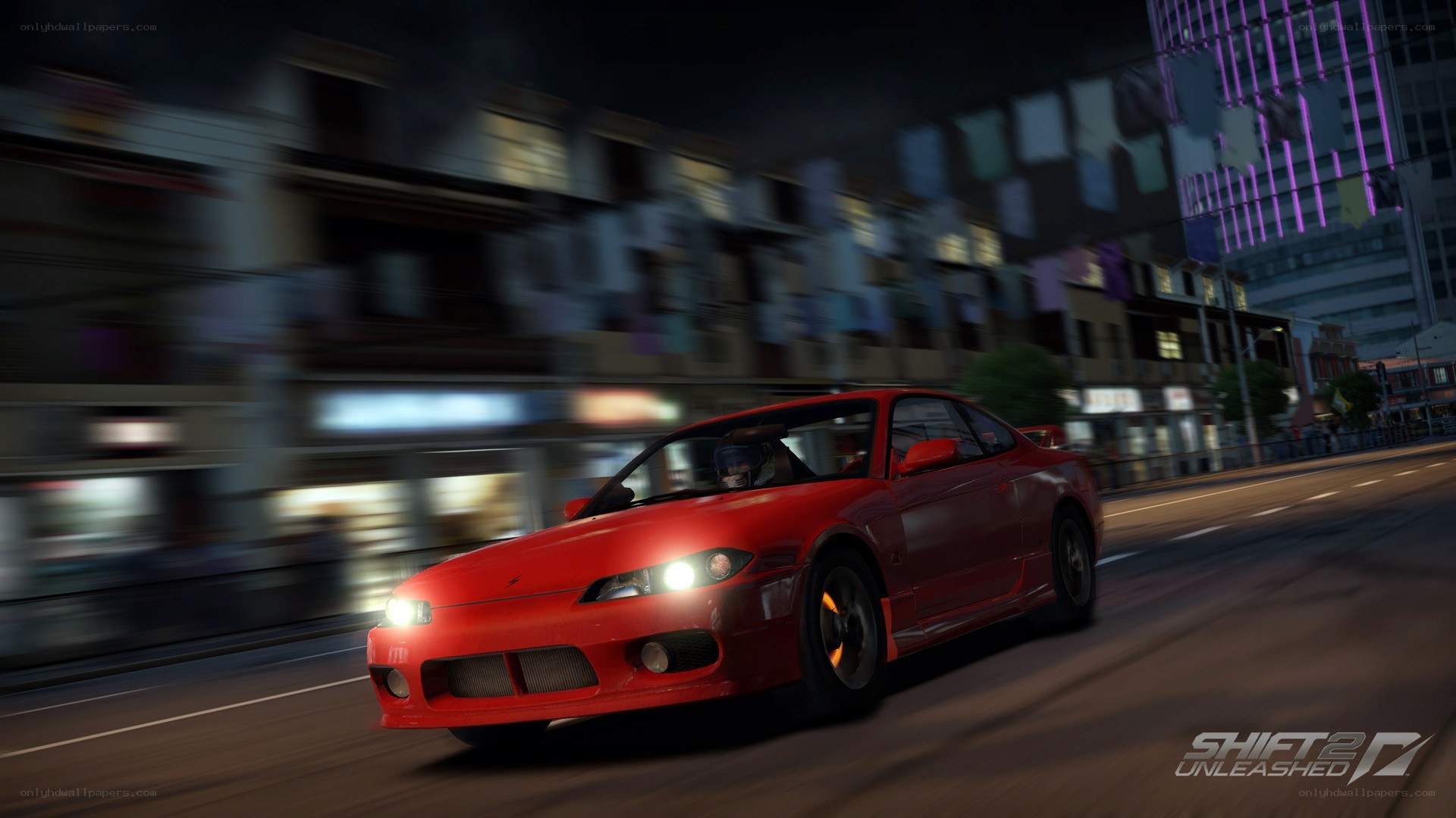 Red car racing at night