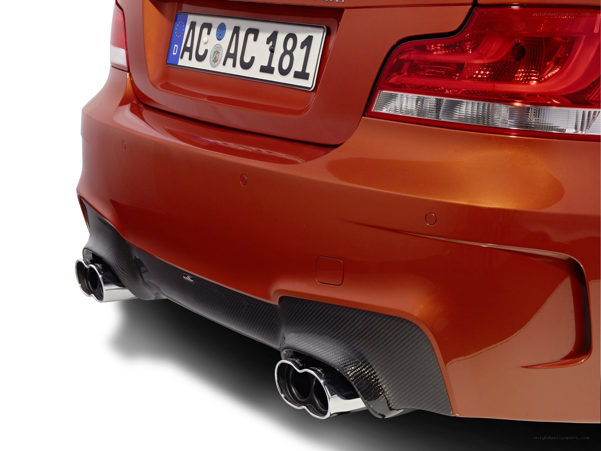 red car rear with exhaust