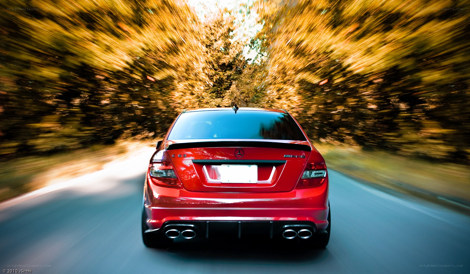 Red car speeding on road