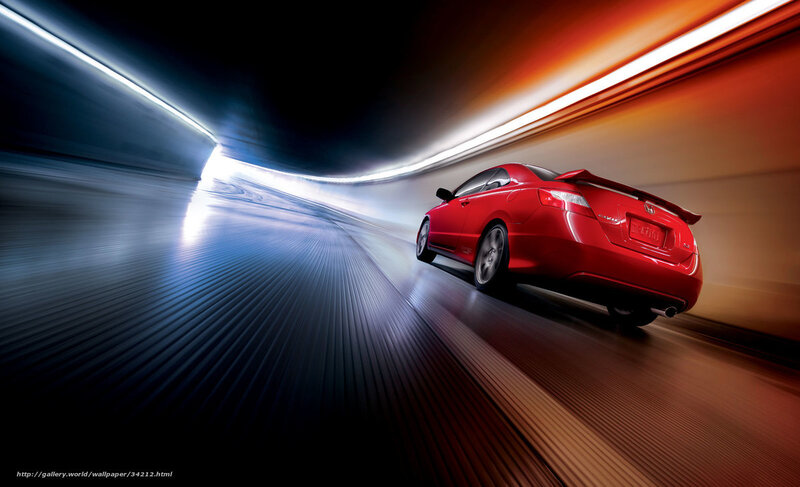 Red car speeding through tunnel