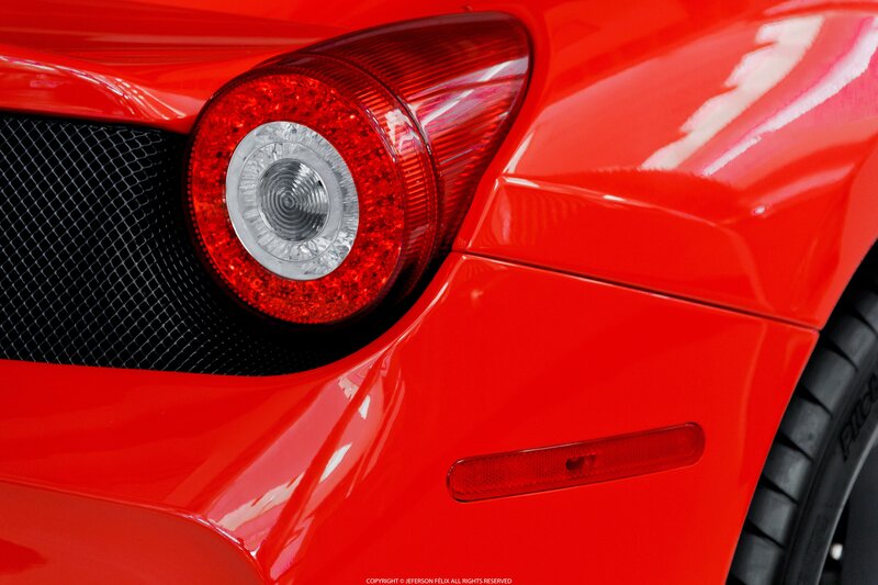 Red Car Taillight — Dramatic, Photograph, Grille