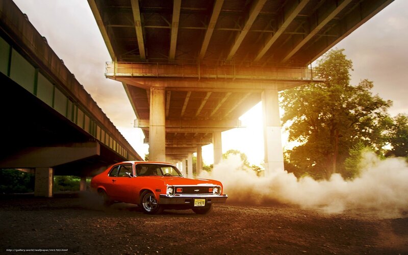 Red car under bridge