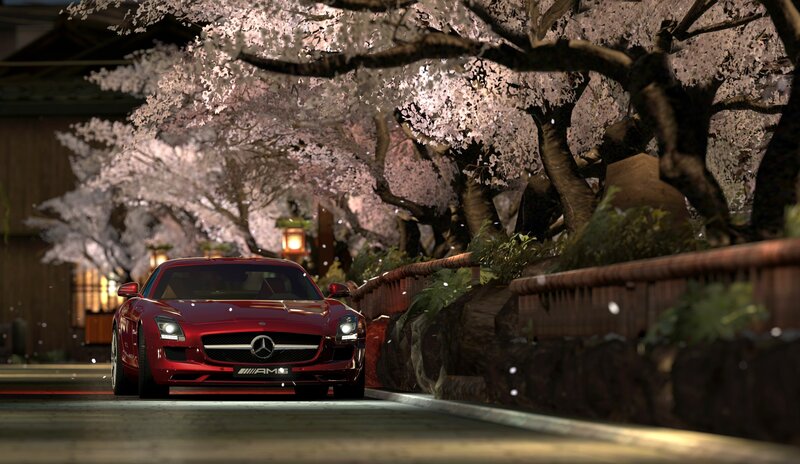 Red car under cherry blossoms