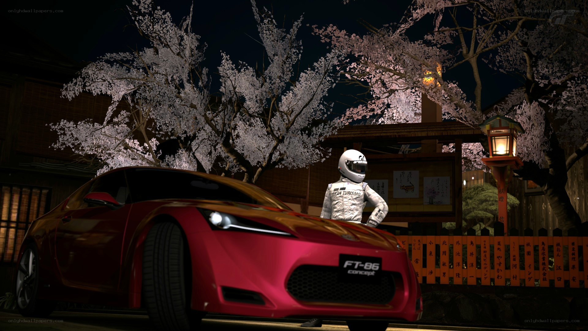 Red car under cherry blossoms