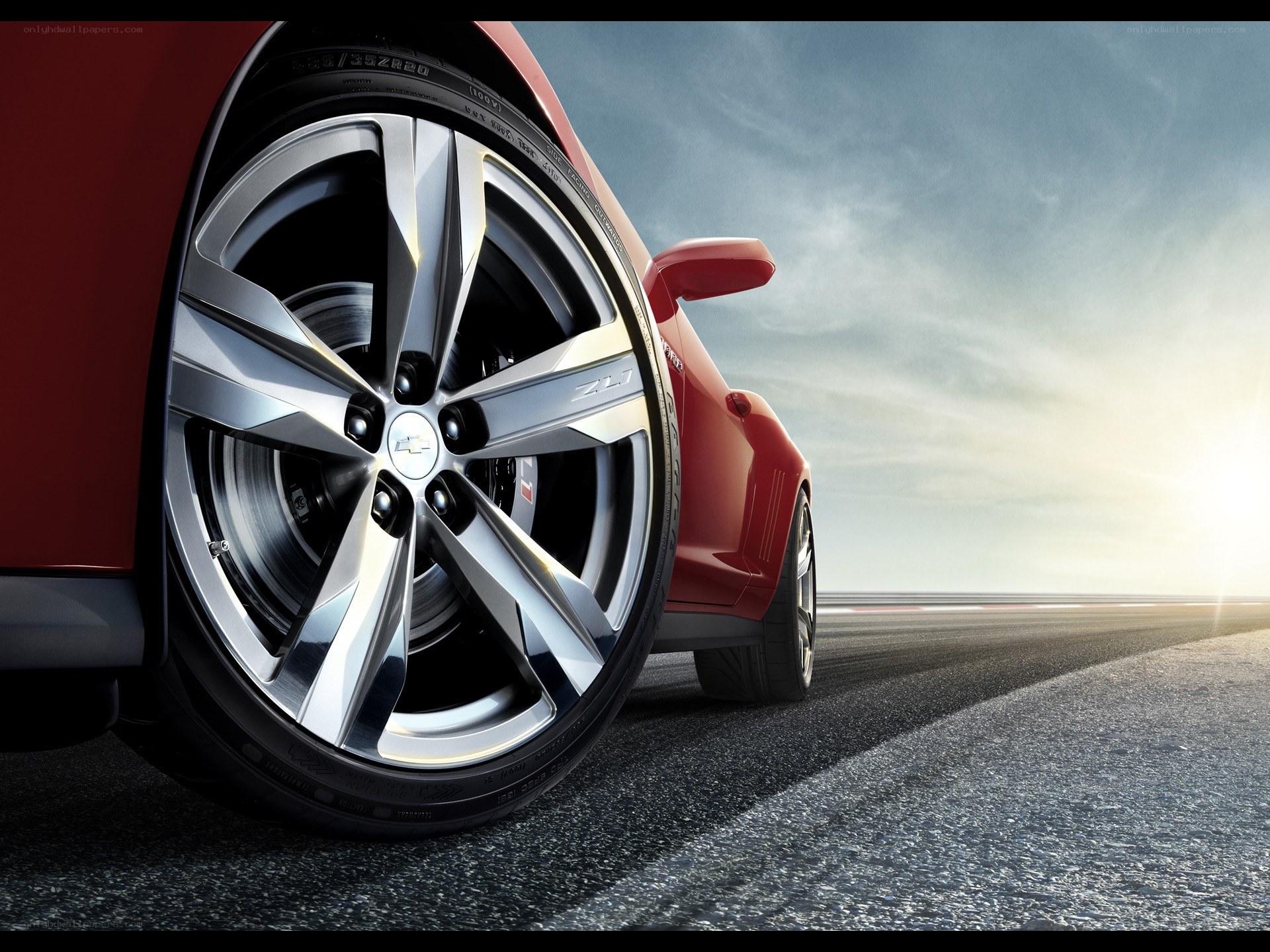 Red car wheel on racetrack