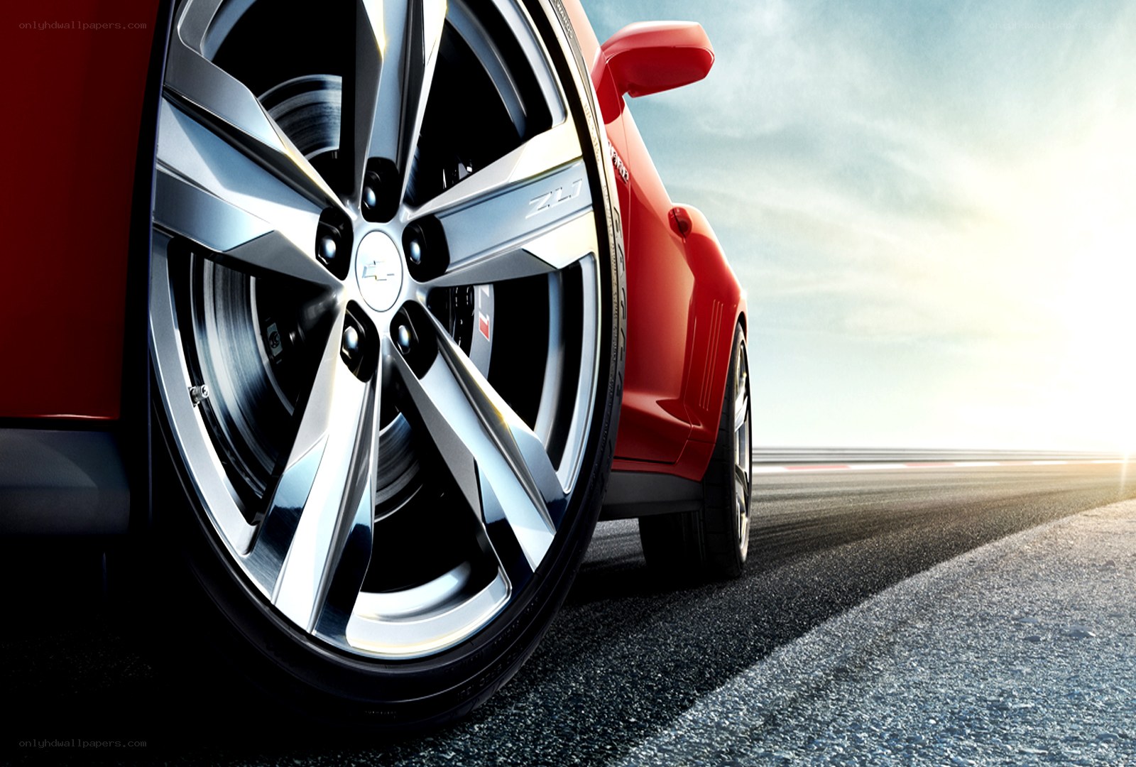 Red car wheel on racetrack