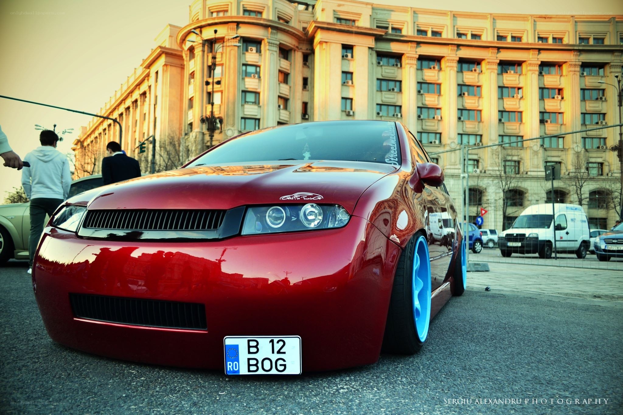 Red car with blue wheels