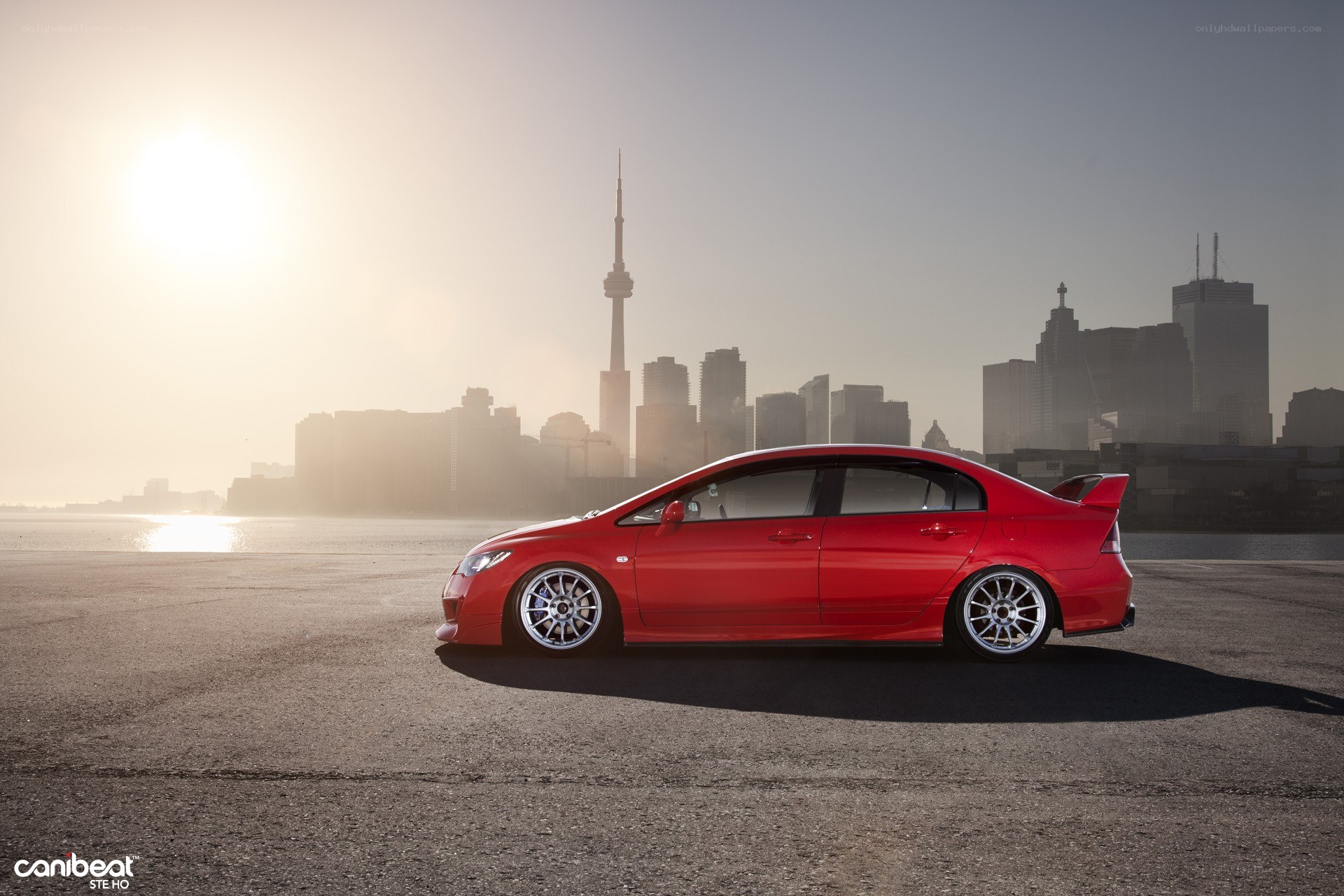 Red car with city skyline