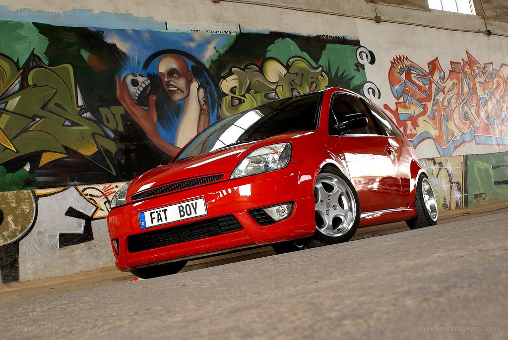 Red car with graffiti art