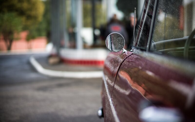 red car with raindrops