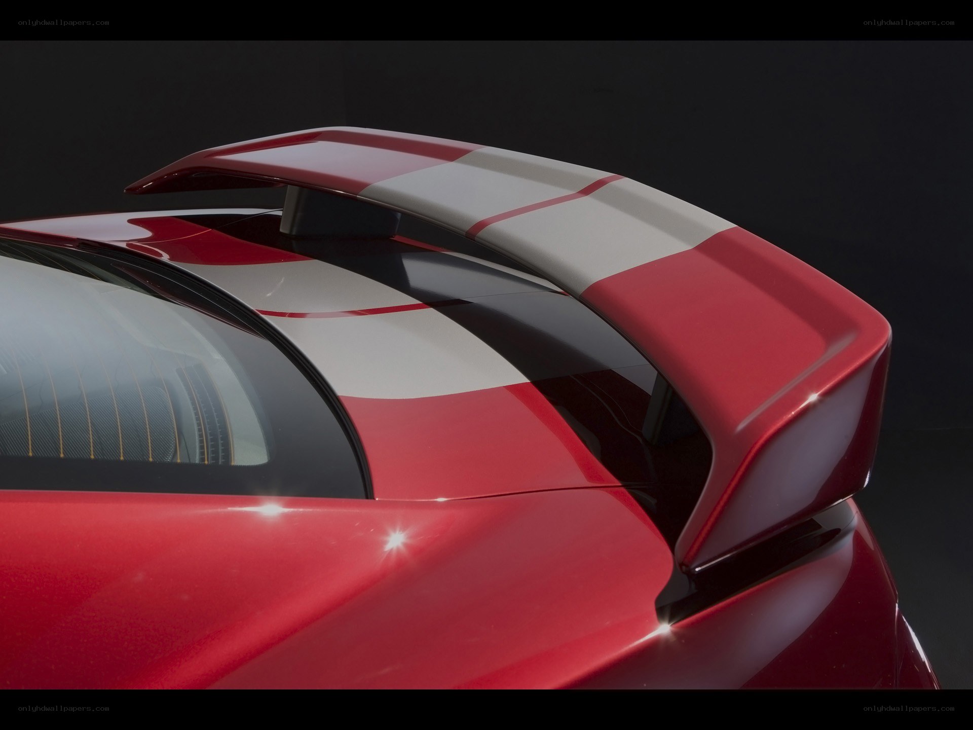 red car with rear spoiler