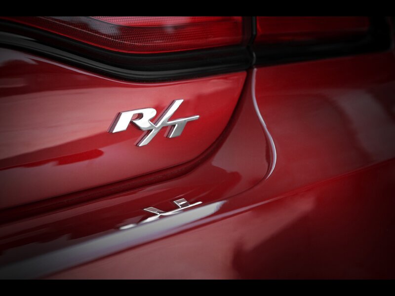 Red car with RHT badge