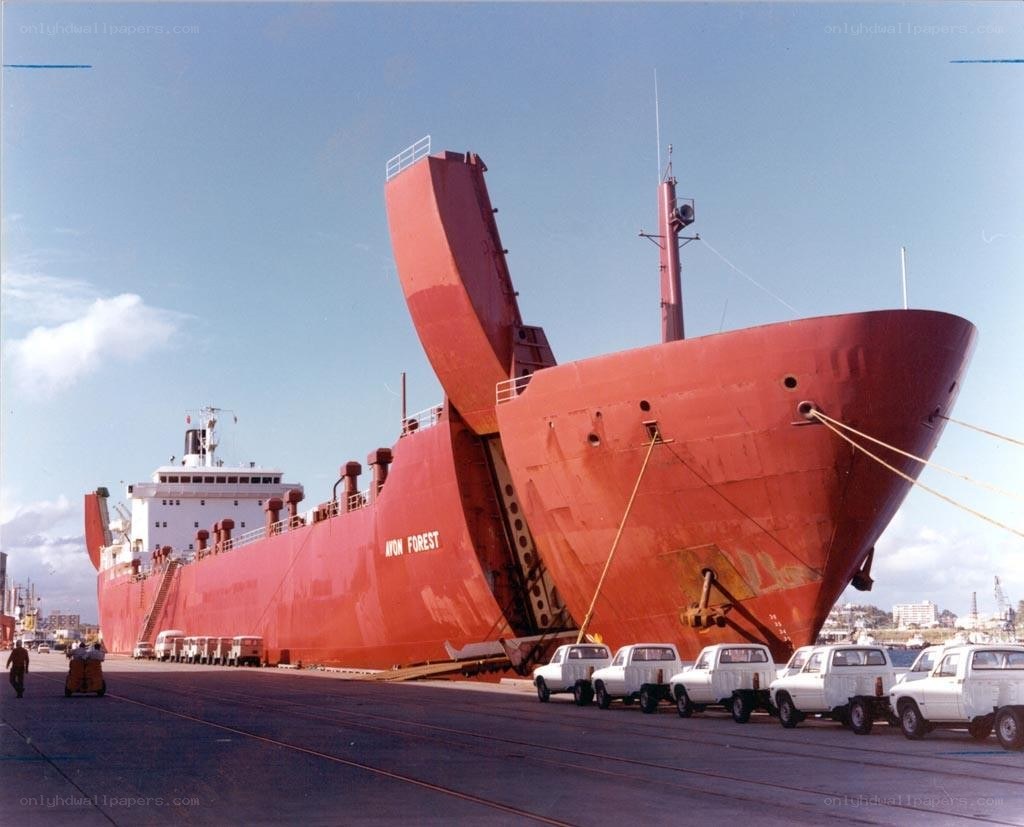 Red cargo ship at port