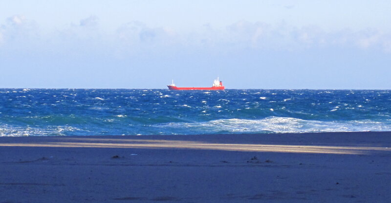 Red Cargo Ship at Sea
