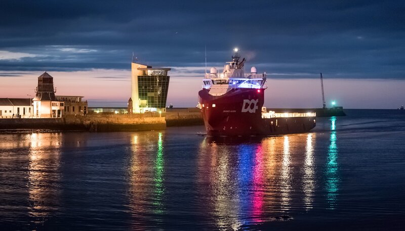 Red Cargo Ship in Harbor — Blue