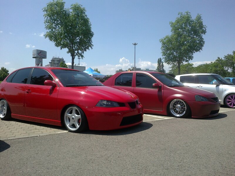 Red cars at a car show