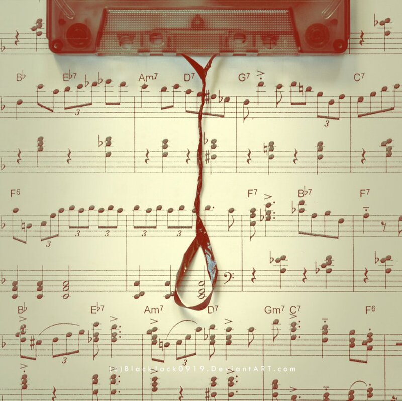 Red Cassette Tape on Sheet Music