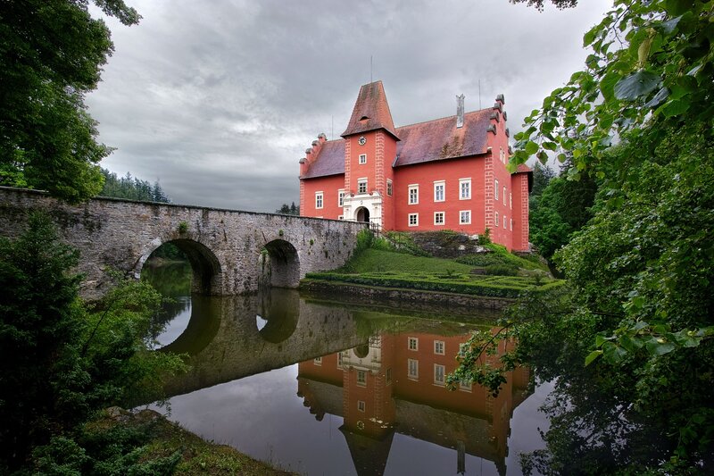 Red castle with stone bridge