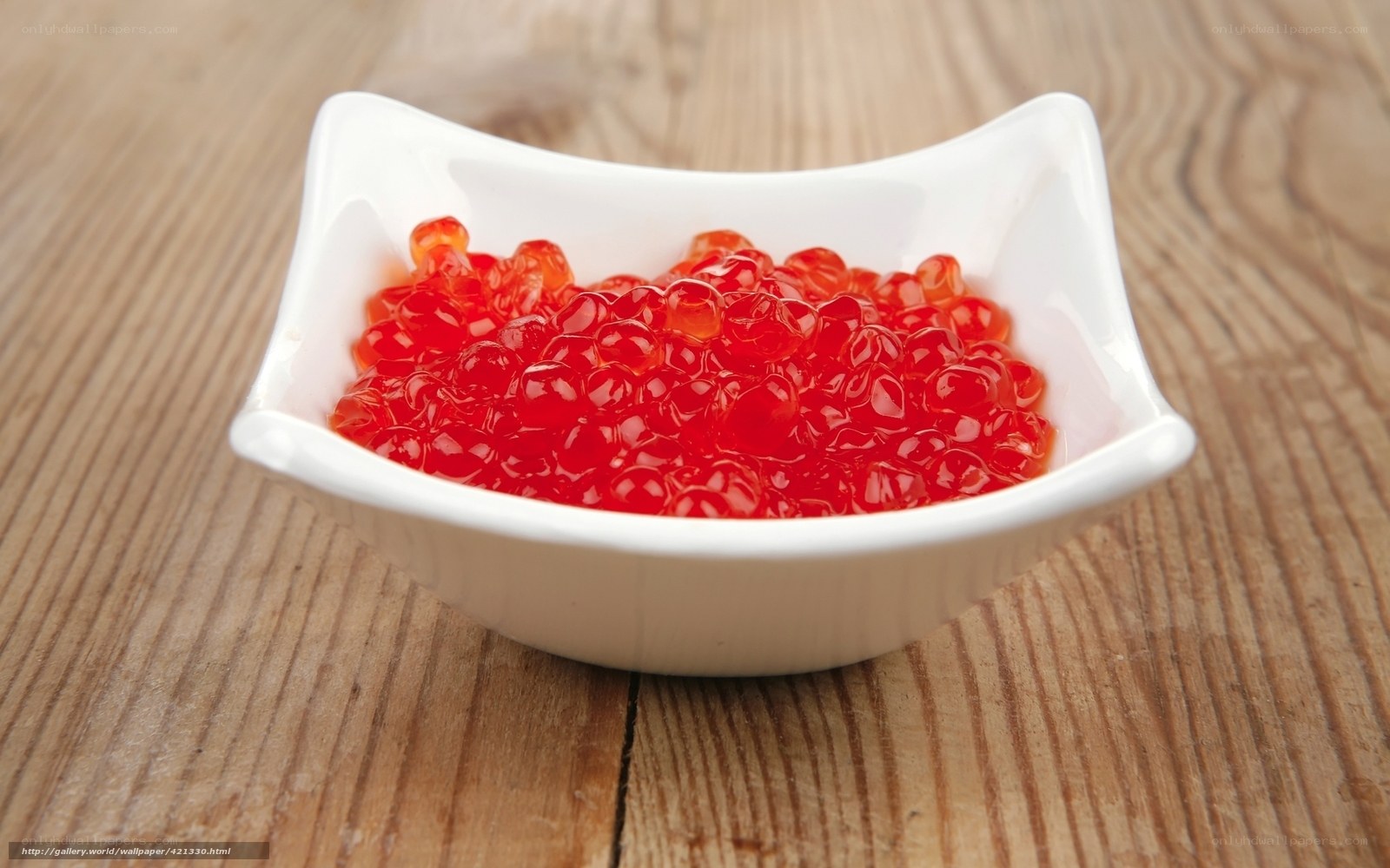 red caviar in a white bowl