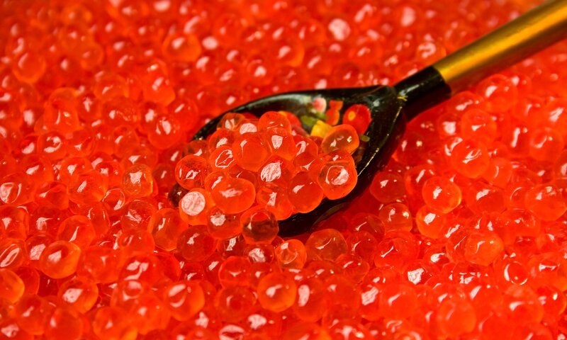 red caviar on a spoon