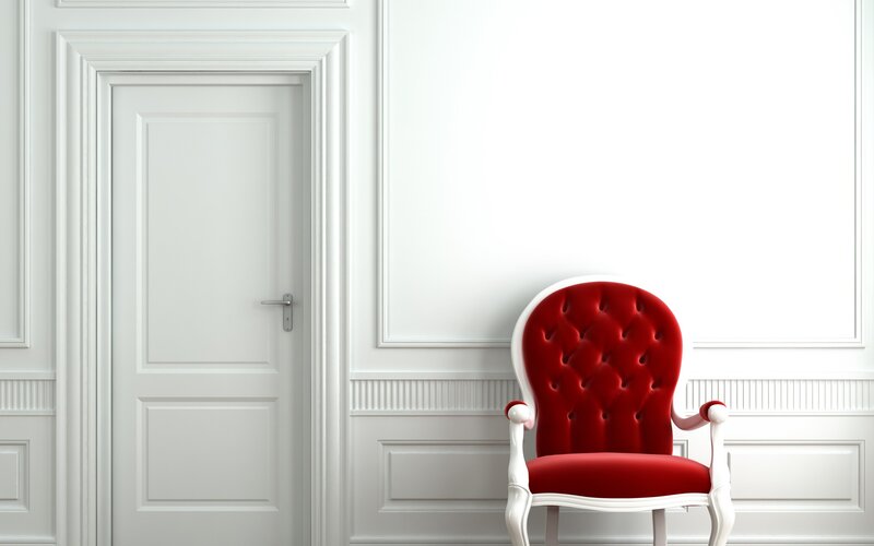 Red chair in white room