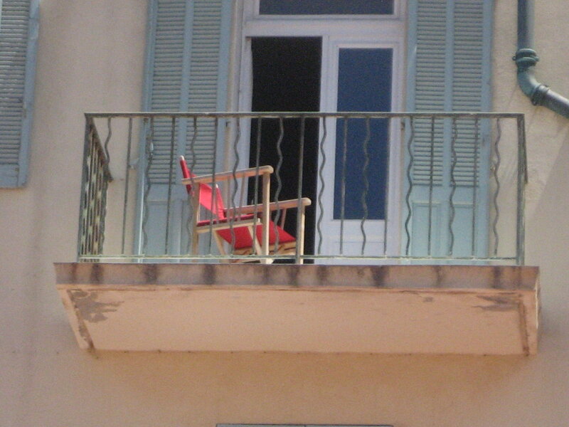 Red Chair on Balcony