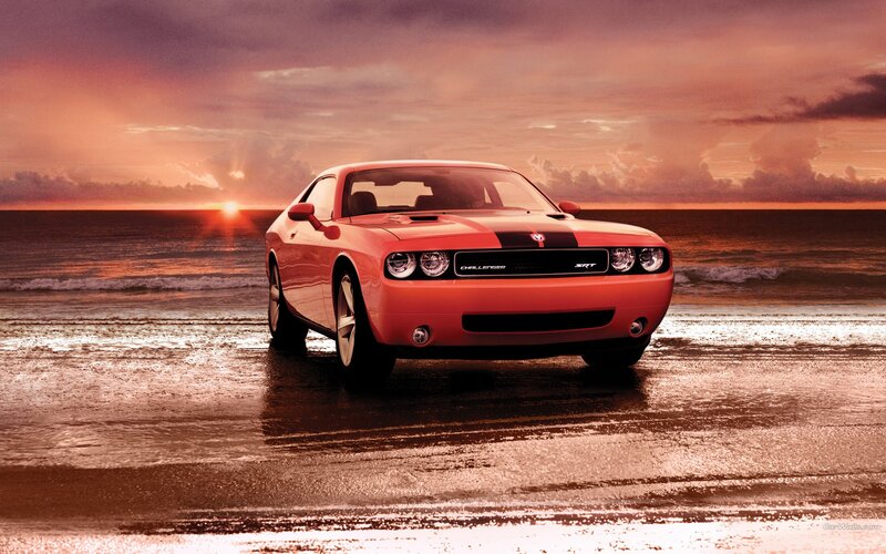 Red Challenger on beach at sunset