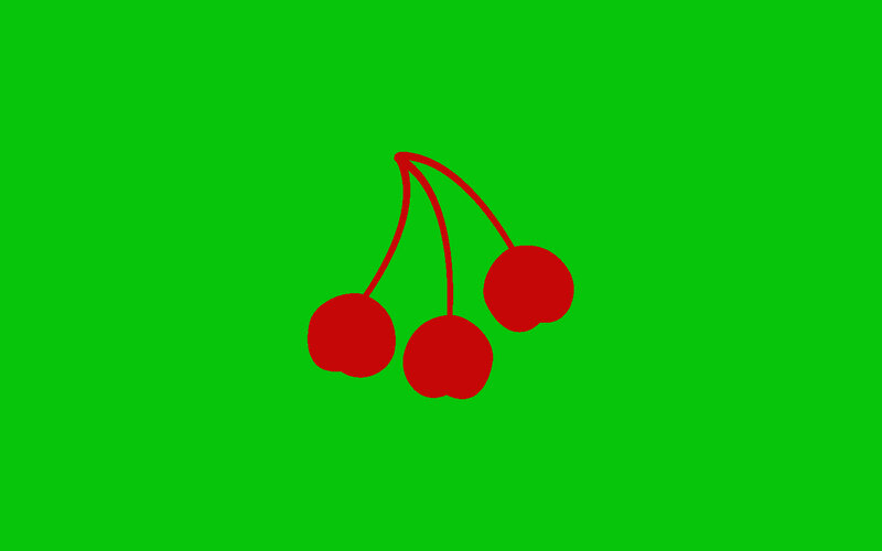 red cherries on green background