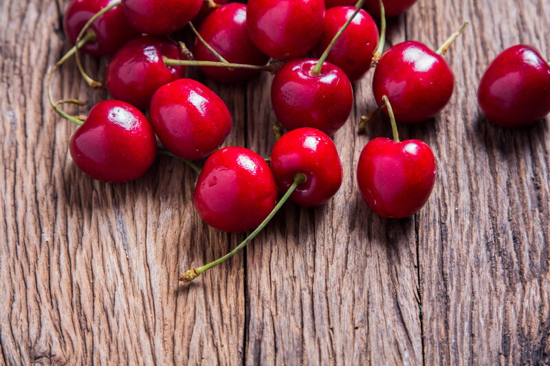 Red Cherries on Wood