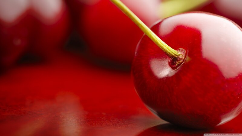 Red Cherry on Surface — Close-up