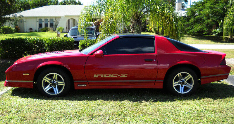 Red Chevrolet Camaro — Calm, Afternoon, Photograph, House