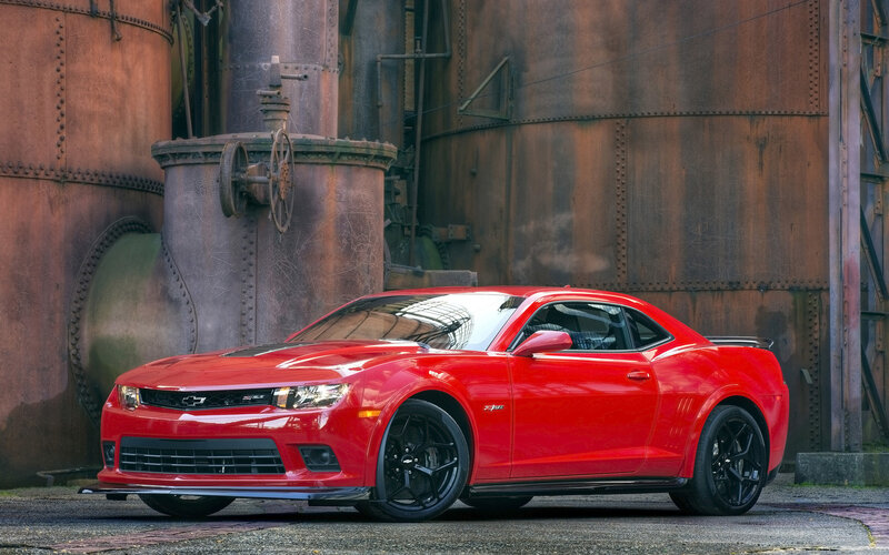 Red Chevrolet Camaro — Dramatic, Photograph, Industrial Tanks