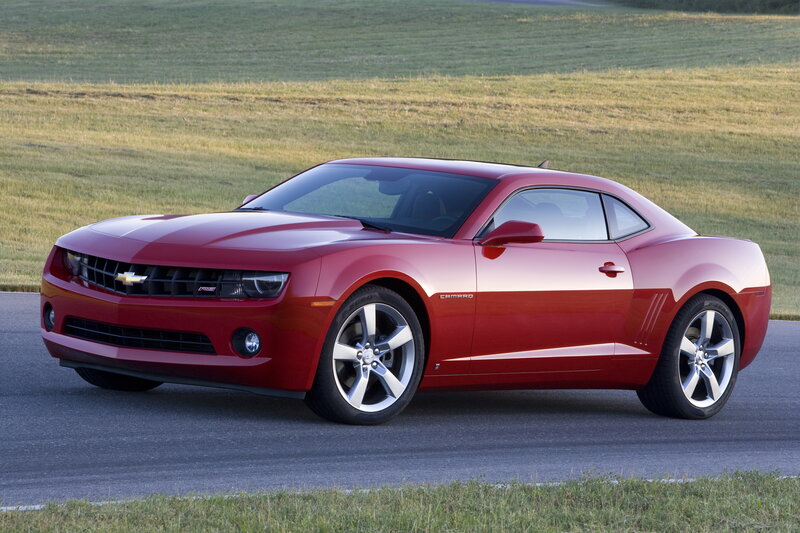 Red Chevrolet Camaro on a road