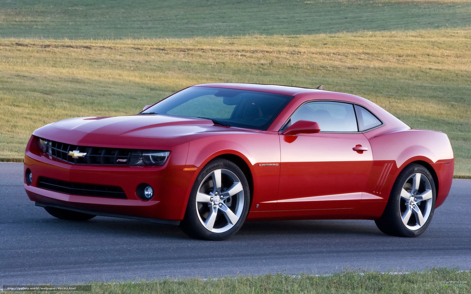 Red Chevrolet Camaro on a road