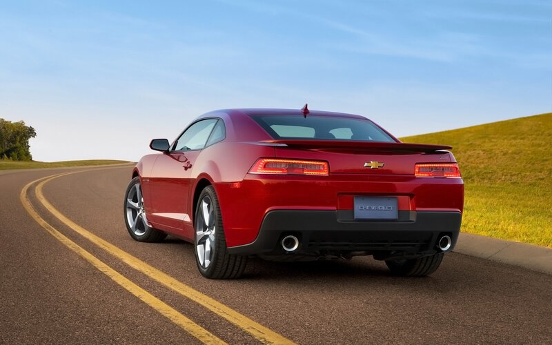 Red Chevrolet Camaro on a winding road