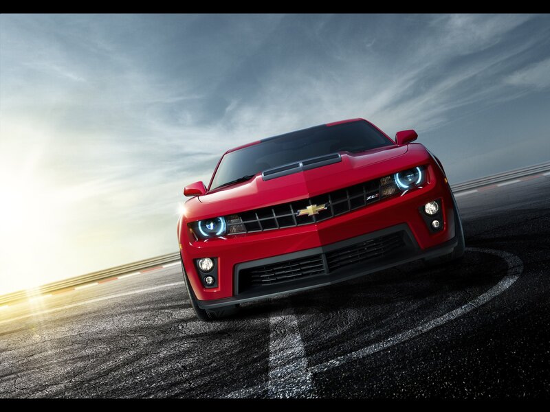Red Chevrolet Camaro on racetrack