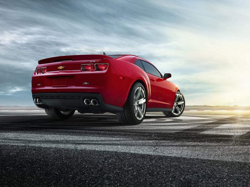 Red Chevrolet Camaro on racetrack